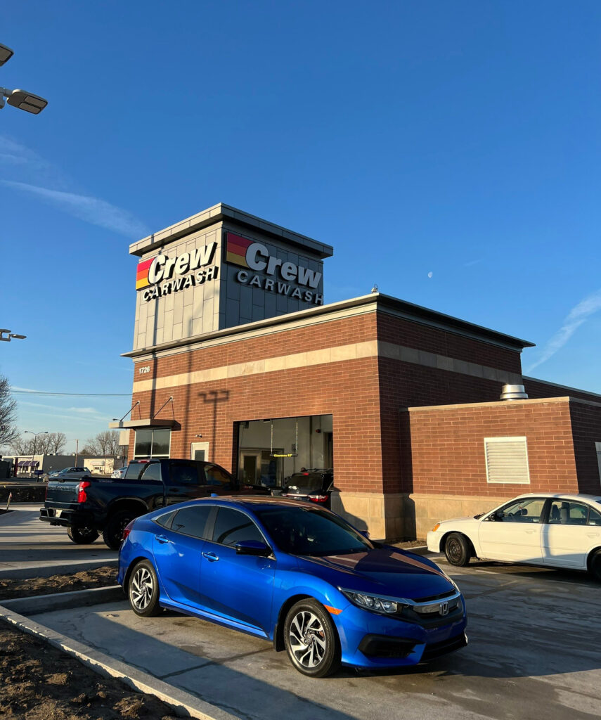 Crew Carwash facility roofing installation on commercial building