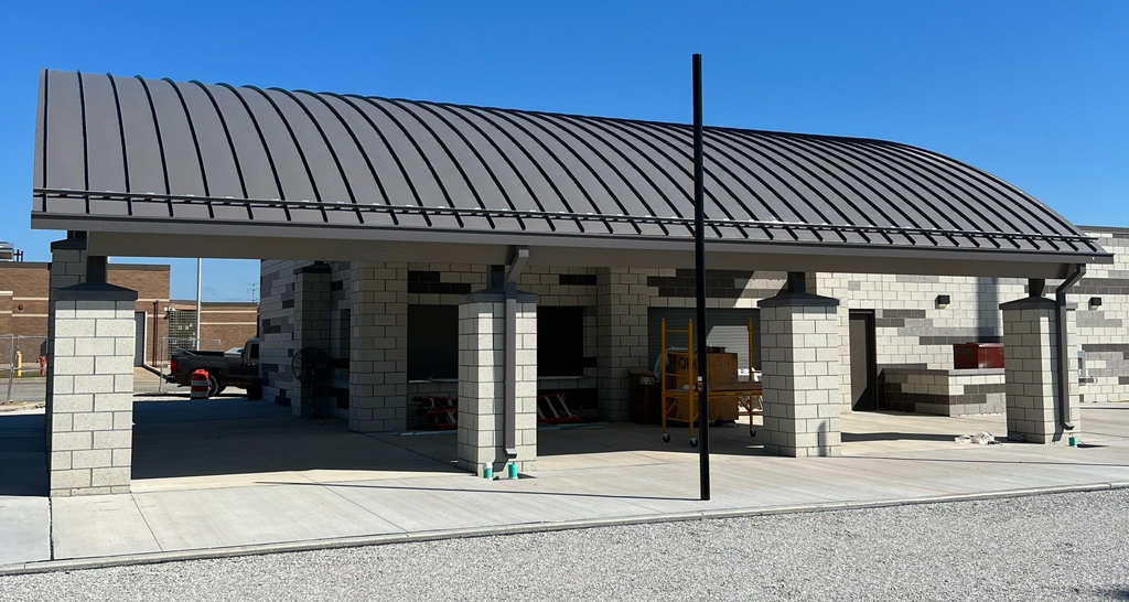 Standing seam metal roof panels on a commercial building